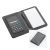 Palmsized black leatherlook cover holds a dualpowered (solar or battery) 8digit calculator on inside cover. Portfolio includes writing pad made and a SKILCRAFT rubberizedgrip retractable pen. Black NA NA
